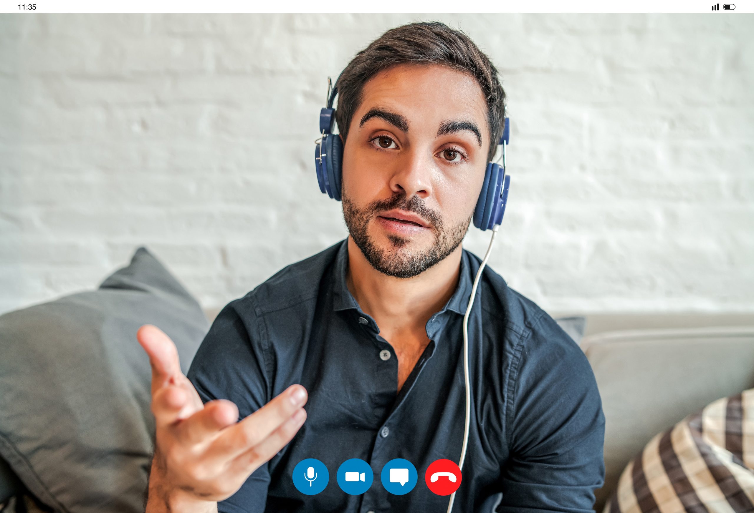 Young businessman on a work video call while staying at home.